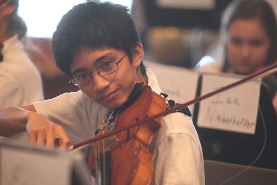 Julio rehearses with the World Youth Symphony Orchestra as a student at Interlochen Arts Camp.